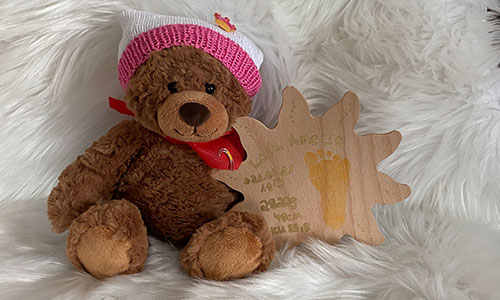 Teddybär mit Holzsonne